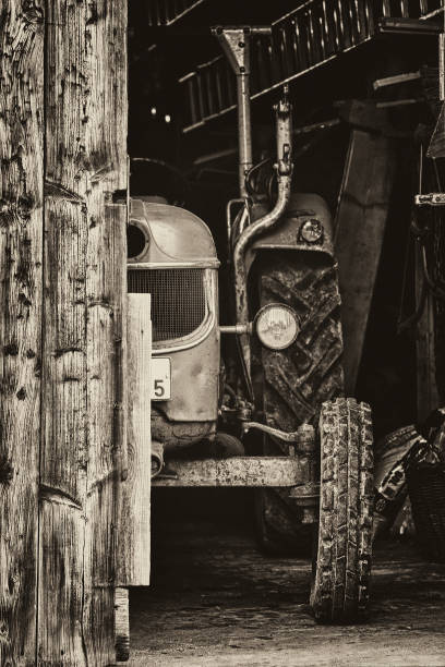 istock No. 5 stands. Old tractor.  - old tractor in a barn - 831031592