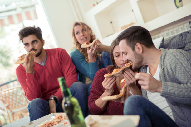 istock Friends having fun at home 831035628