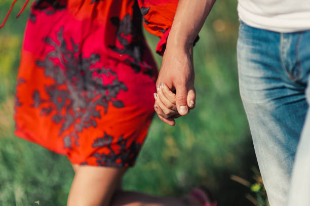 istock Couple in love hold hands for a walk 831039282