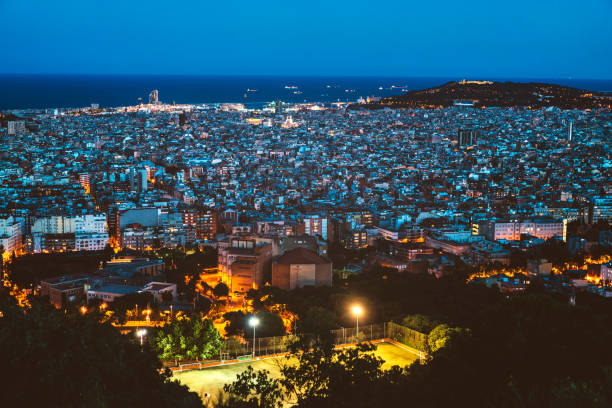 istock Barcelona aerial panorama over sunset cityscape, Spain 831039944