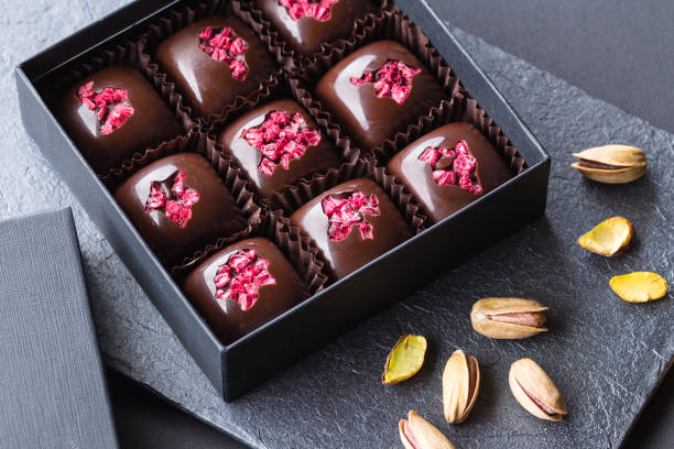 istock Luxury handmade bonbons with freeze-dried raspberry 831042964