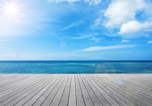 Wooden balcony beside tropical sea