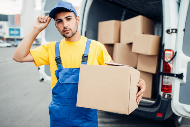 istock Cargo delivery, male courier with box in hand 831049226