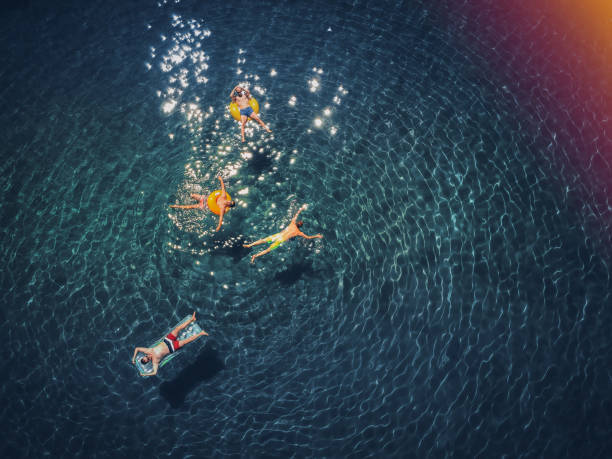 istock Friends relaxing in the ocean 831049962