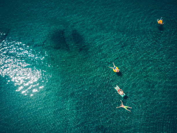 istock Friends relaxing in the ocean 831050028