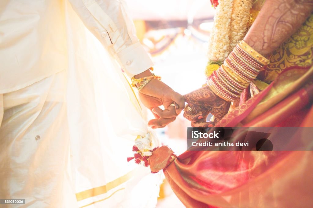 hindu wedding hindu wedding bride and groom celebrating wedding event with flower decorations Wedding Stock Photo