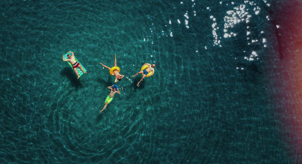 istock Friends relaxing in the ocean 831050102