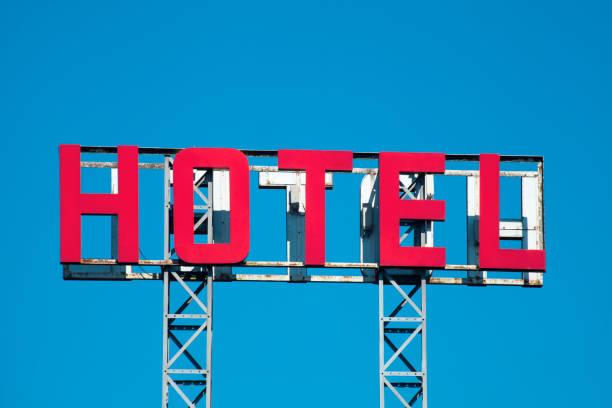 istock Hotel sign in the sunlight, clear blue sky background. 831050232