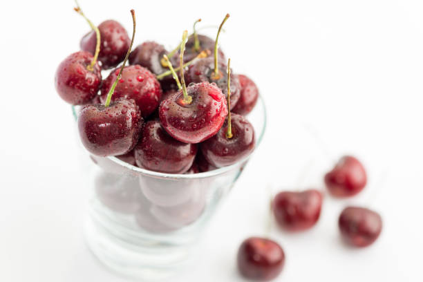 istock Sweet Fresh Red Cherries with Water Drops on White Background 831057300
