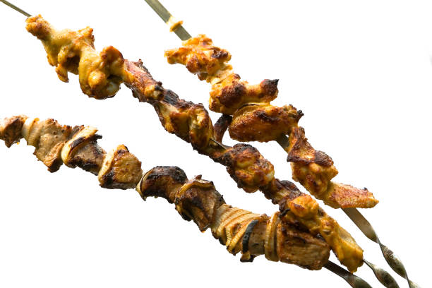 istock Chicken and pork shish kebab on a white background. 831060620