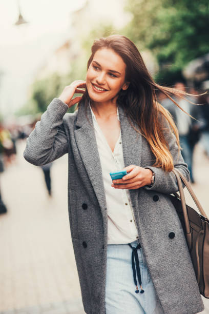 istock Woman texting in the city 831061062