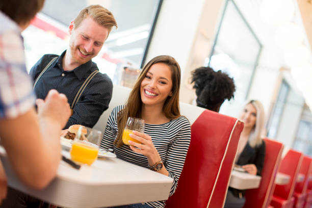 istock Friends eating in diner 831063482