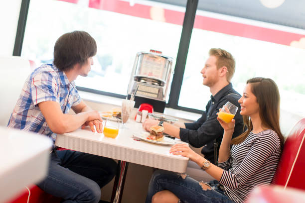 istock Friends eating in diner 831063826