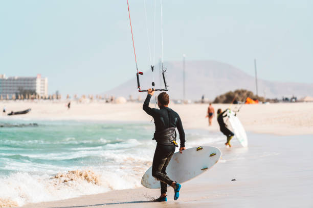 Rio de Janeiro, Brazil - August 08, 2013: Man practicing kite surf at Praia da Barra (Barra beach), a traditional spot for this sport. The heavy winds make this place perfect for it.