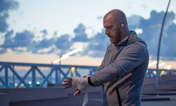 istock Handsome Middle Aged Bearded Man Exercising Outdoors in Northern Europe 831067332