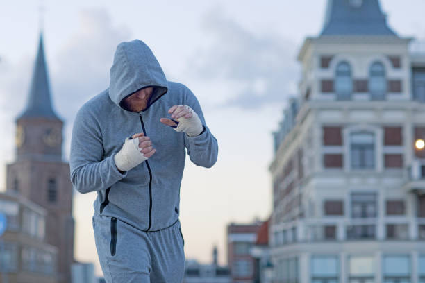 istock Handsome Middle Aged Bearded Man Exercising Outdoors in Northern Europe 831067384