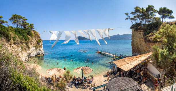 Lounge island with hidden beach. Island in front of Zakinthos to be reached by footbridge. Small hidden paradise, local best kept secret. Local people are spending their afternoon there