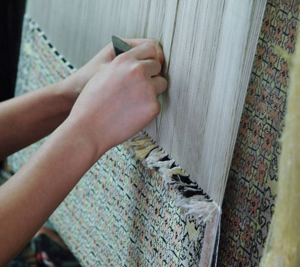 istock production and weaving of carpets and fabrics 831071762