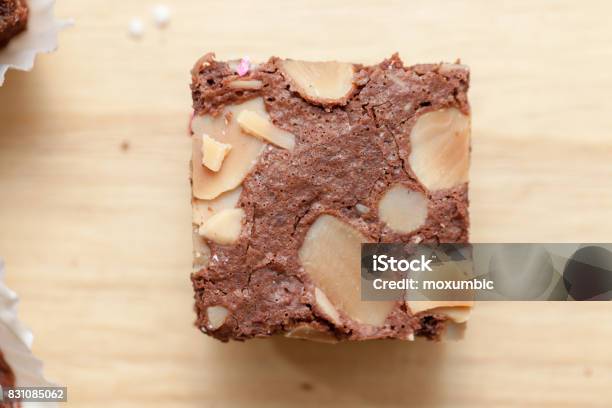 Close Up Of Of Brownie Cake On Wooden Plate Stock Photo - Download Image Now - Bakery, Black Color, Brown