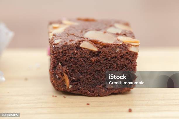 Close Up Of Of Brownie Cake On Wooden Plate Stock Photo - Download Image Now - Bakery, Black Color, Brown