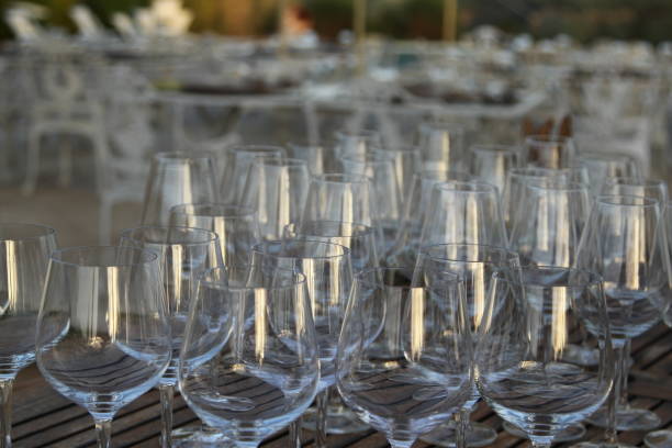 istock Wine glasses on wooden table 831085144
