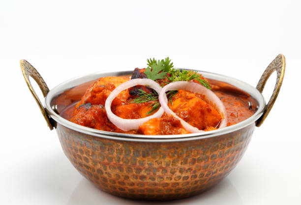 istock Indian Food or Indian Curry in a copper brass serving bowl. 831085352