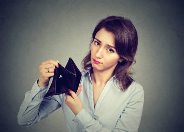 Woman with no money. Sad businesswoman holding empty wallet Woman with no money. Sad businesswoman holding empty wallet over spend stock pictures, royalty-free photos & images