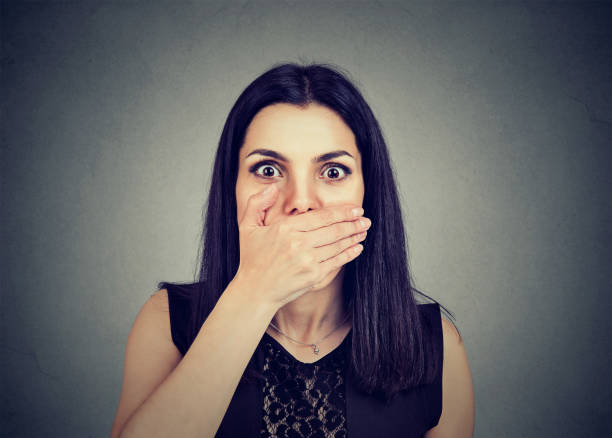istock Concerned scared woman with hand on mouth 831093068