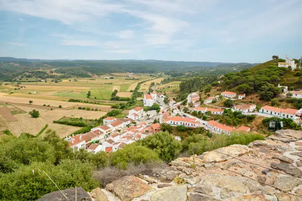 View to the small town of Aljezur with traditional portuguese houses and rural landscape, Algarve Portugal