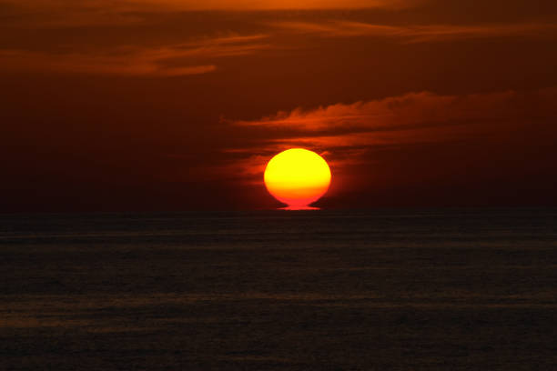 istock Sunset at the beach in the red sky 831100050