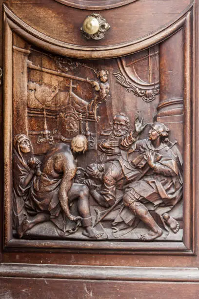 Detail of the wood door of the baroque Asamkirche church, Munich, Bavaria, Germany.
