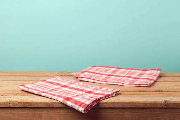 istock Empty wooden deck table with tablecloth over mint background for product montage display 831109800