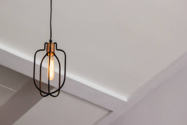 istock Vintage metal lamp hanging on ceiling. Copy space. Light in cafe. 831114848