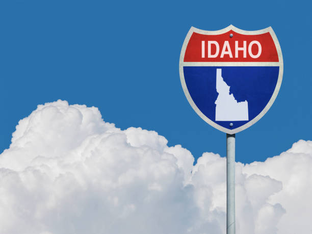 istock Highway sign for Interstate road in Idaho with map in front of clouds 831117118