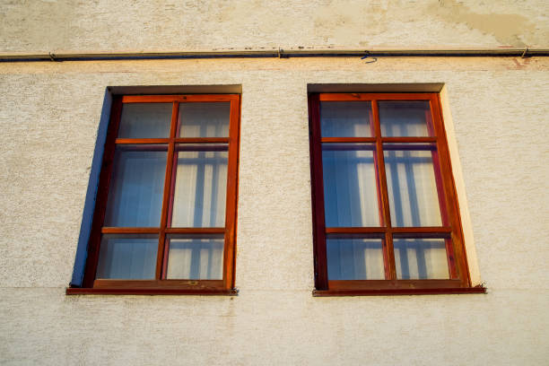 istock Two wooden windows on the wall 831117154