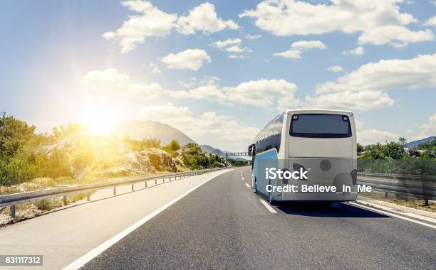 Bus Rushes Along The Asphalt Highspeed Highway Stock Photo - Download Image Now - Bus, Travel, Journey