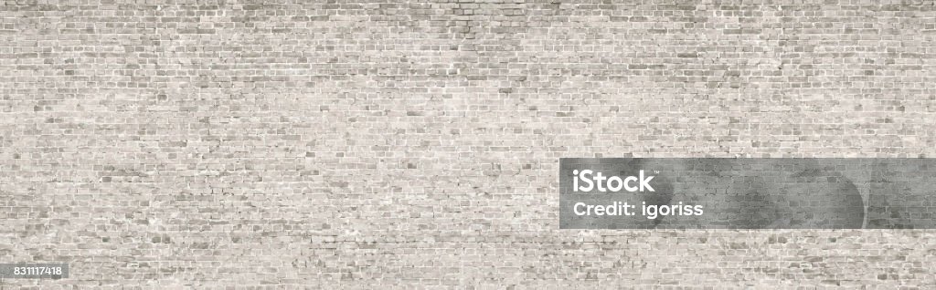 White wash old brick wall panorama. Vintage whitewashed brick wall panoramic background texture. Home and office modern design backdrop Brick Wall Stock Photo