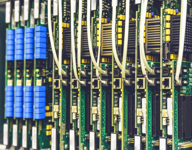 istock Electrical equipment, printed boards in network server data center, telecommunications equipment 831117546