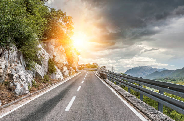 istock Highway outside the city receding into the highlands 831122162