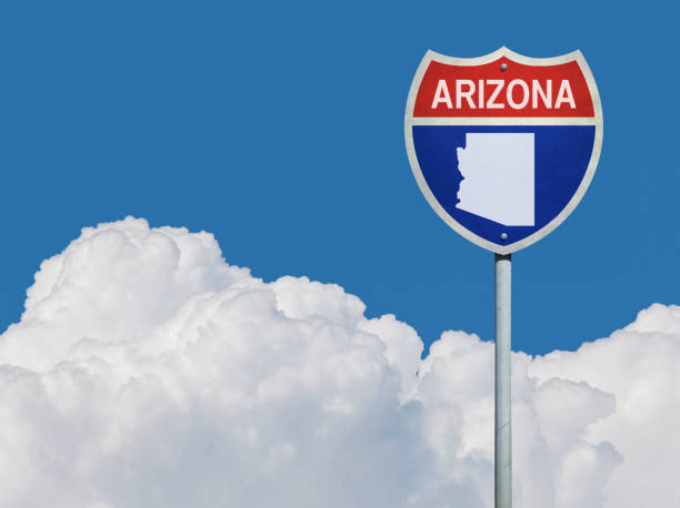 istock Highway sign for Interstate road in Arizona with map in front of clouds 831124504