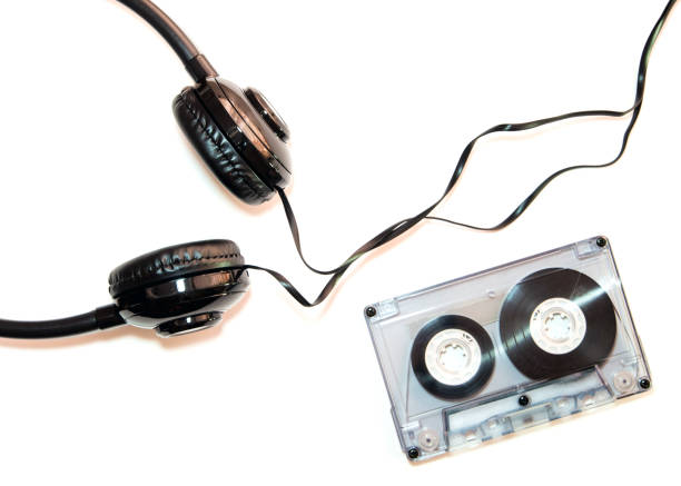 istock Audio cassette tape and headphone, isolated 831127998