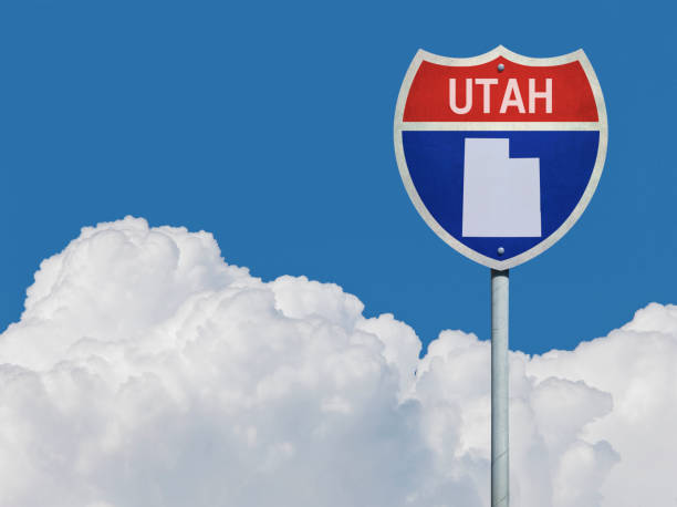 istock Highway sign for Interstate road in Utah with map in front of clouds 831128354