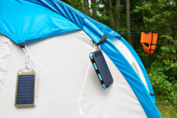 istock Hiking hand-held portable batteries solar panels on tent 831134630