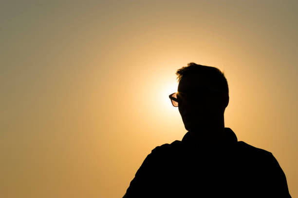 istock Young male against the light at sunset 831142154