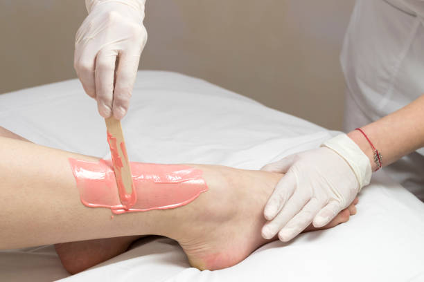 istock Process depilation female legs and hands 831143474