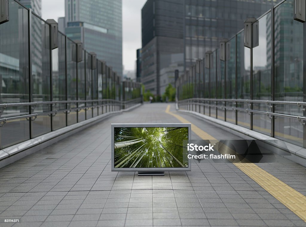 Flat TV placed on urban street, Shiodome area Digital Composite Architecture Stock Photo