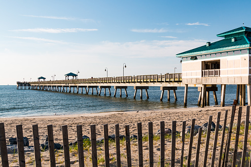 Hampton, Virginia - July 9, 2017:  The Buckroe Beach fishing pier, located on the site of a former plantation.  The area is now a popular tourist attraction for the beach, fishing and public park.