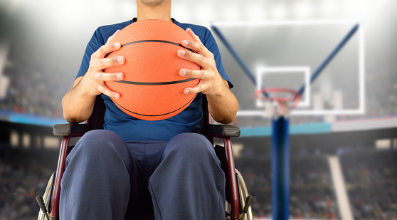 cropped basketball player in wheelchair at stadium