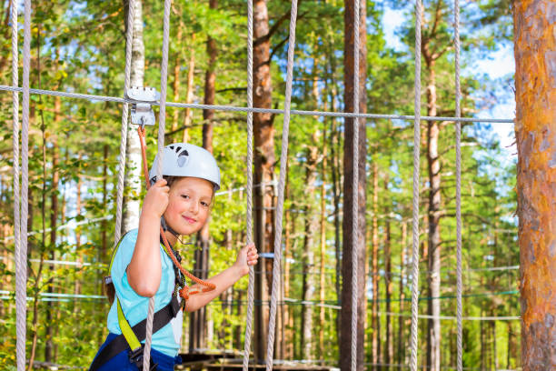 istock Girl on hinged trail in extreme rope Park 831150856