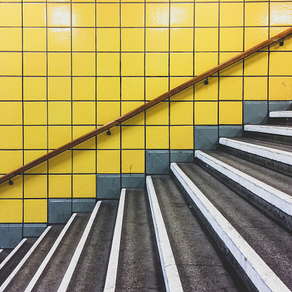 white striped stairs, concrete steps  in underground station
